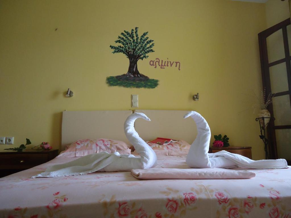 Postel nebo postele na pokoji v ubytování Almini Apartments