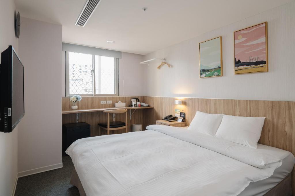 Postel nebo postele na pokoji v ubytování Hotel attic