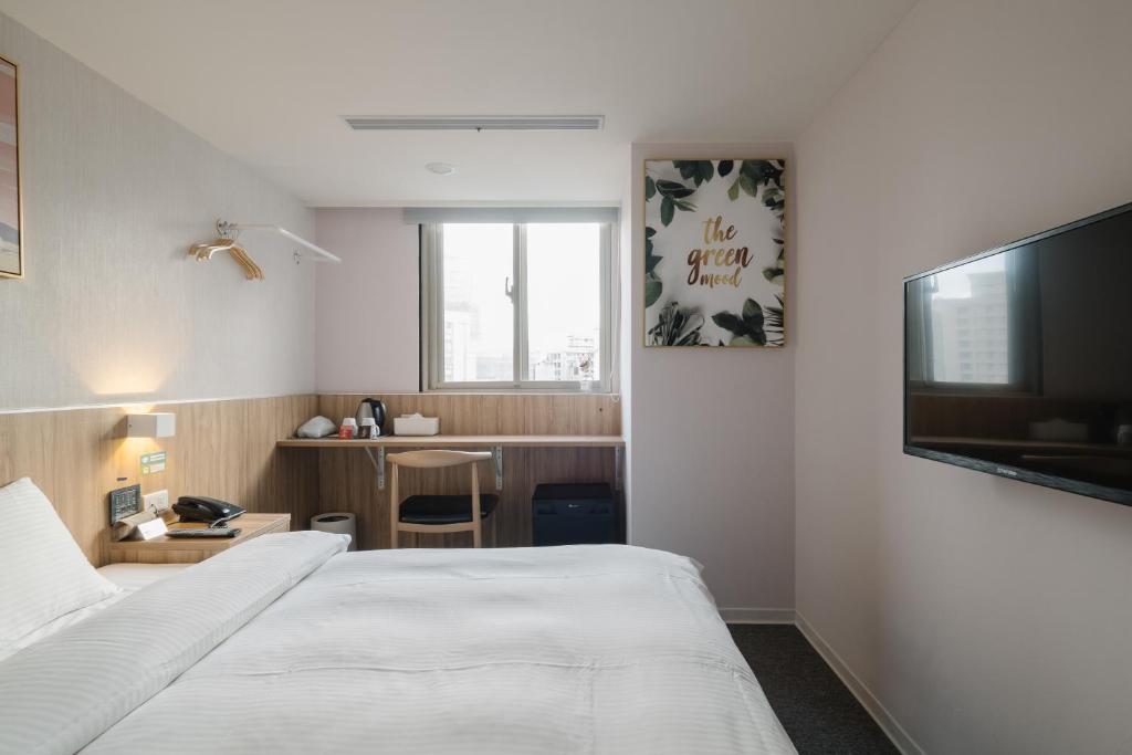 Postel nebo postele na pokoji v ubytování Hotel attic