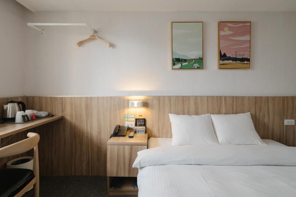 Postel nebo postele na pokoji v ubytování Hotel attic