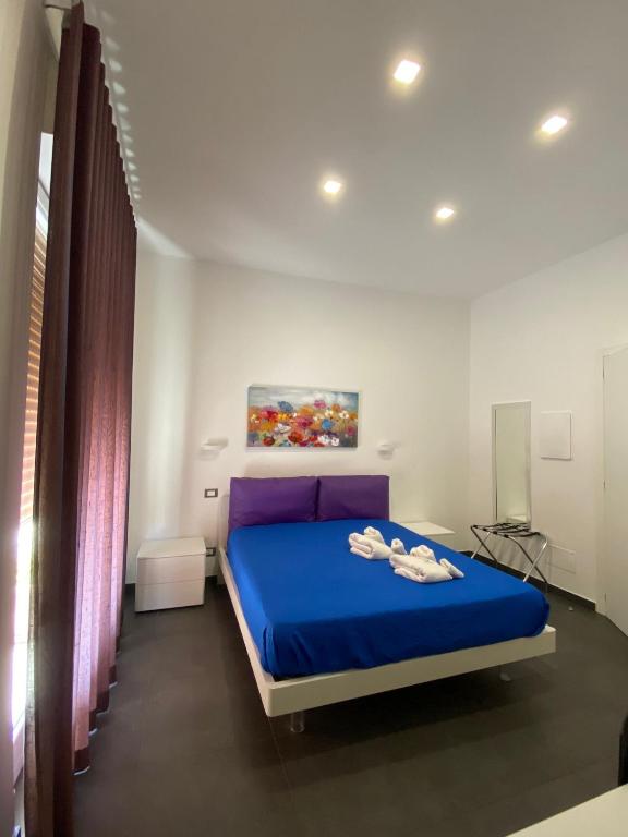 Postel nebo postele na pokoji v ubytování Amuri Room&Suite