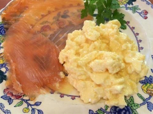 a plate of food with a piece of salmon and mashed potatoes at Old Drynie House, in Inverness