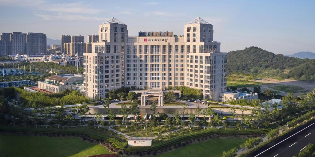 an aerial view of a large building in a city at HUALUXE Ningbo Harbor City, an IHG Hotel in Ningbo
