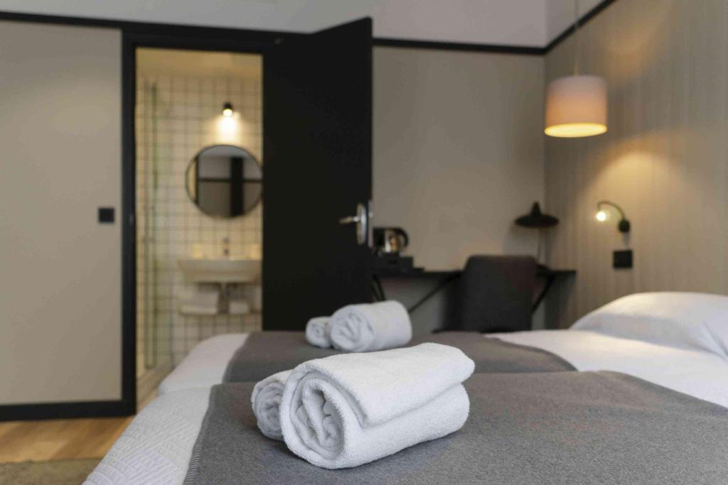 Postel nebo postele na pokoji v ubytování Hotel SUB