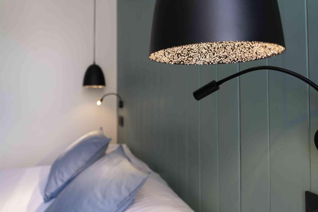 Postel nebo postele na pokoji v ubytování Hotel SUB