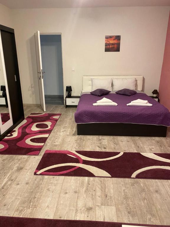 En eller flere senge i et værelse på Guest House Zoreni