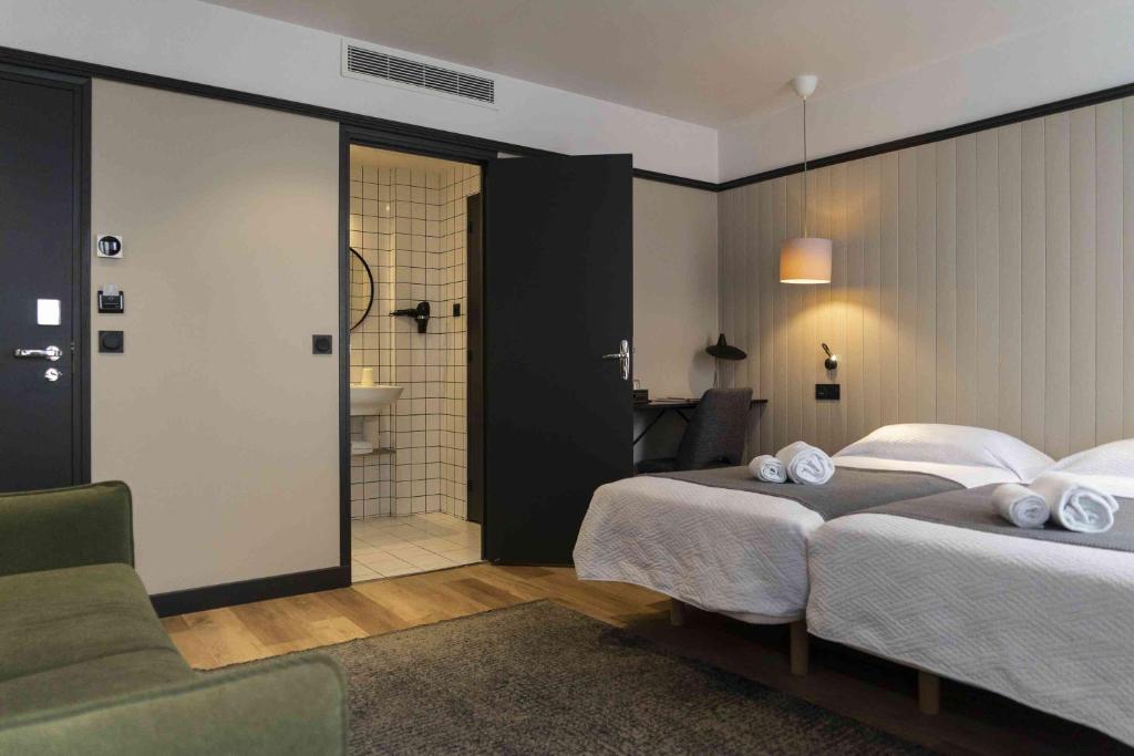 Postel nebo postele na pokoji v ubytování Hotel SUB
