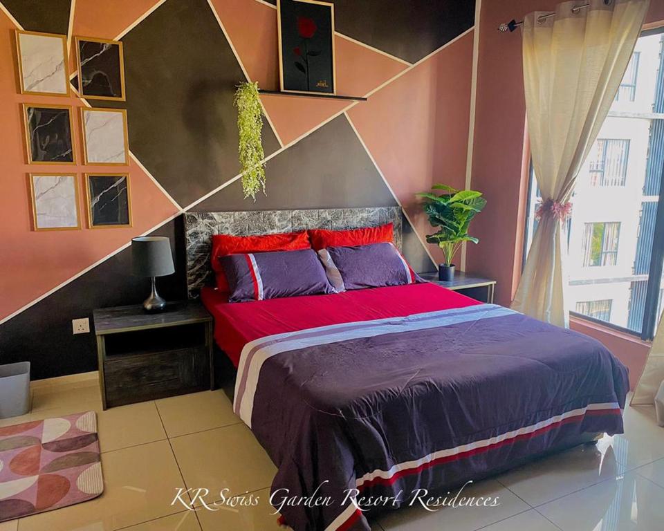 a bedroom with a large bed in a room at KR Swiss Garden Resort Residences Kuantan in Kuantan