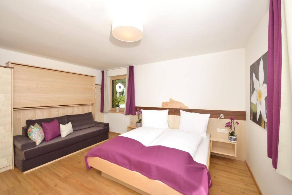 Postel nebo postele na pokoji v ubytování Appartements Kolb