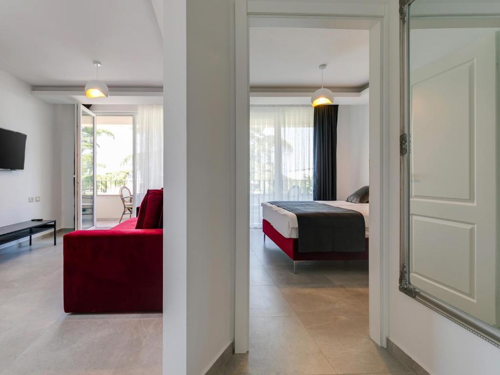Łóżko lub łóżka w pokoju w obiekcie Nadija Apartmani
