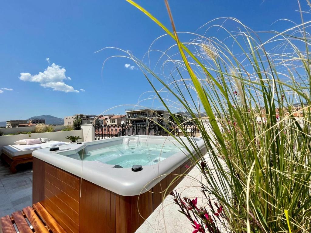 a bath tub sitting on top of a roof at Home Avenue Luxury Townhouse in Olbia