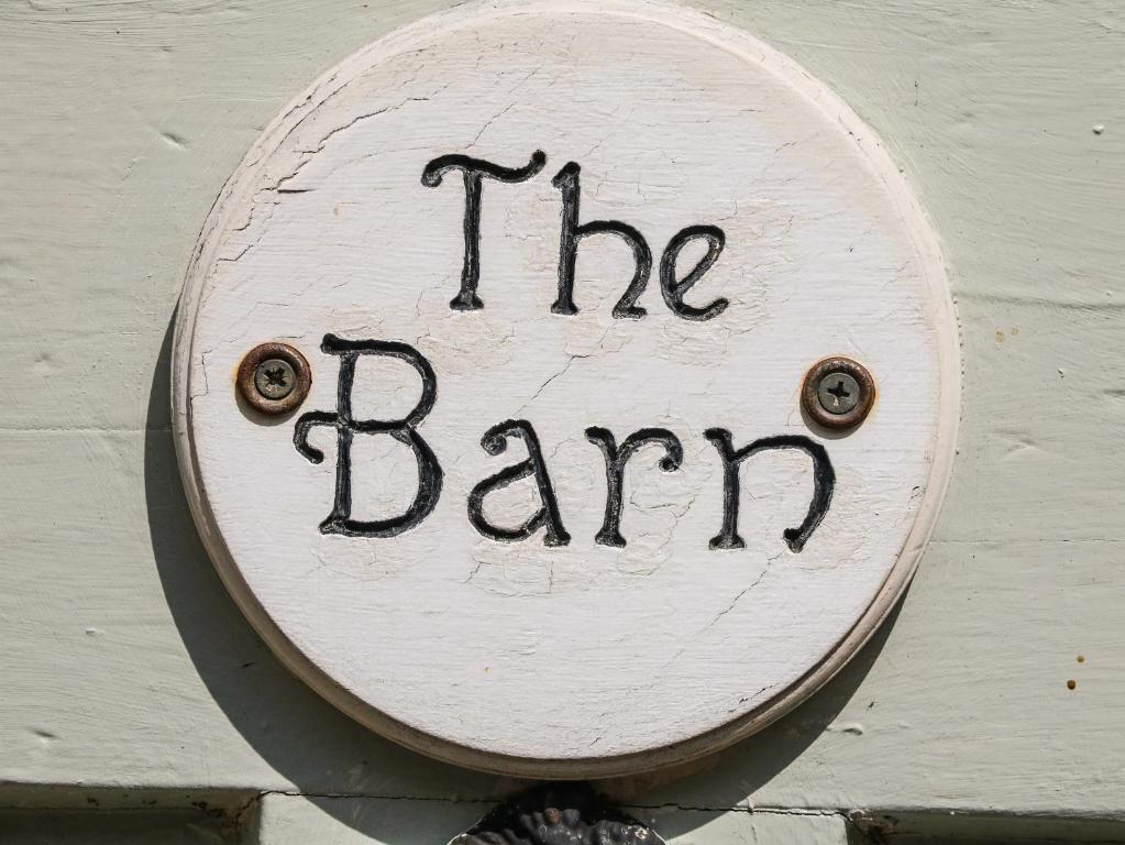a sign that says the bar sign on a wall at The Barn in Buxton