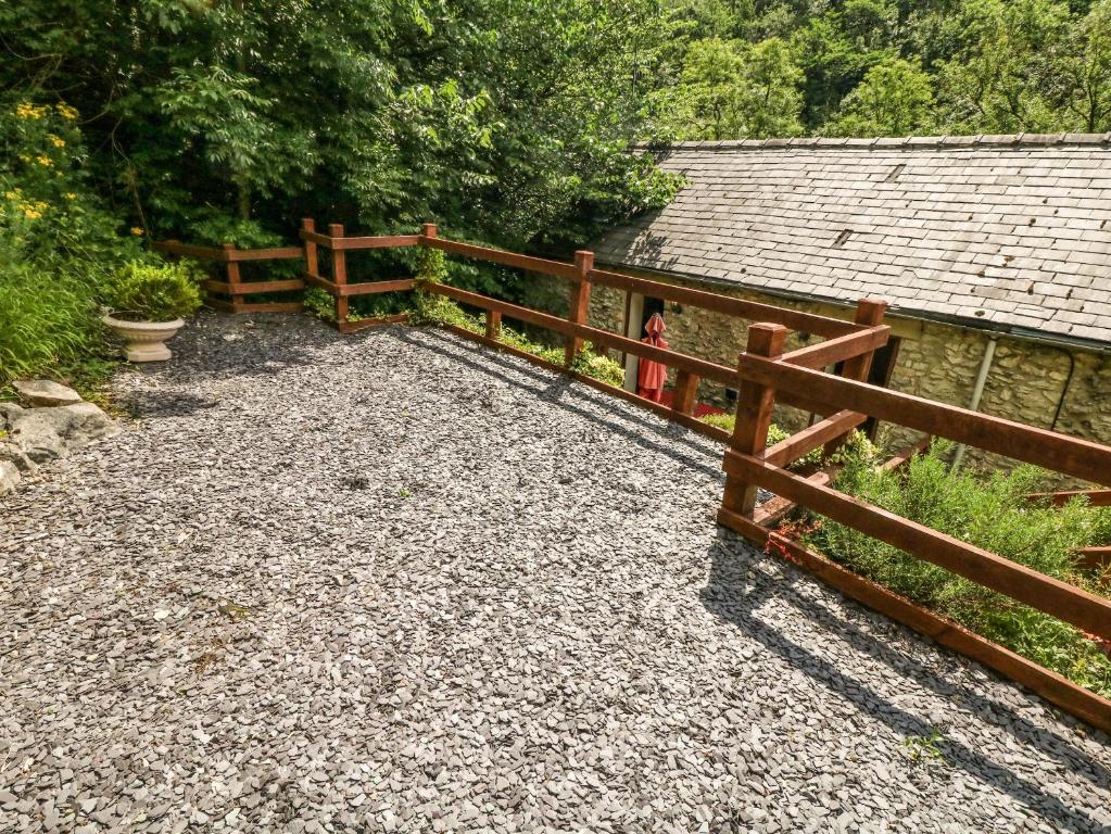a wooden fence in front of a barn at The Barn in Buxton