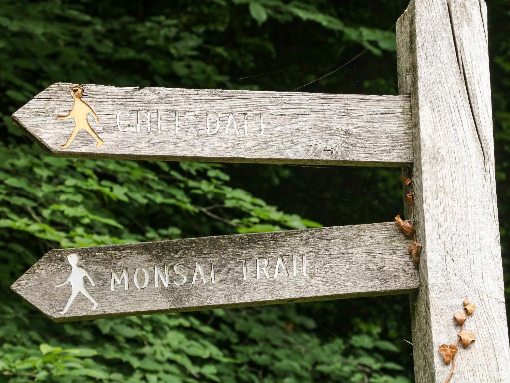 a wooden sign that says gift bar and mason trail at The Barn in Buxton