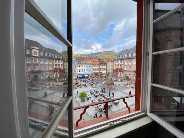 a view of a city from an open window at Boardinghouse Goethehaus in Heidelberg