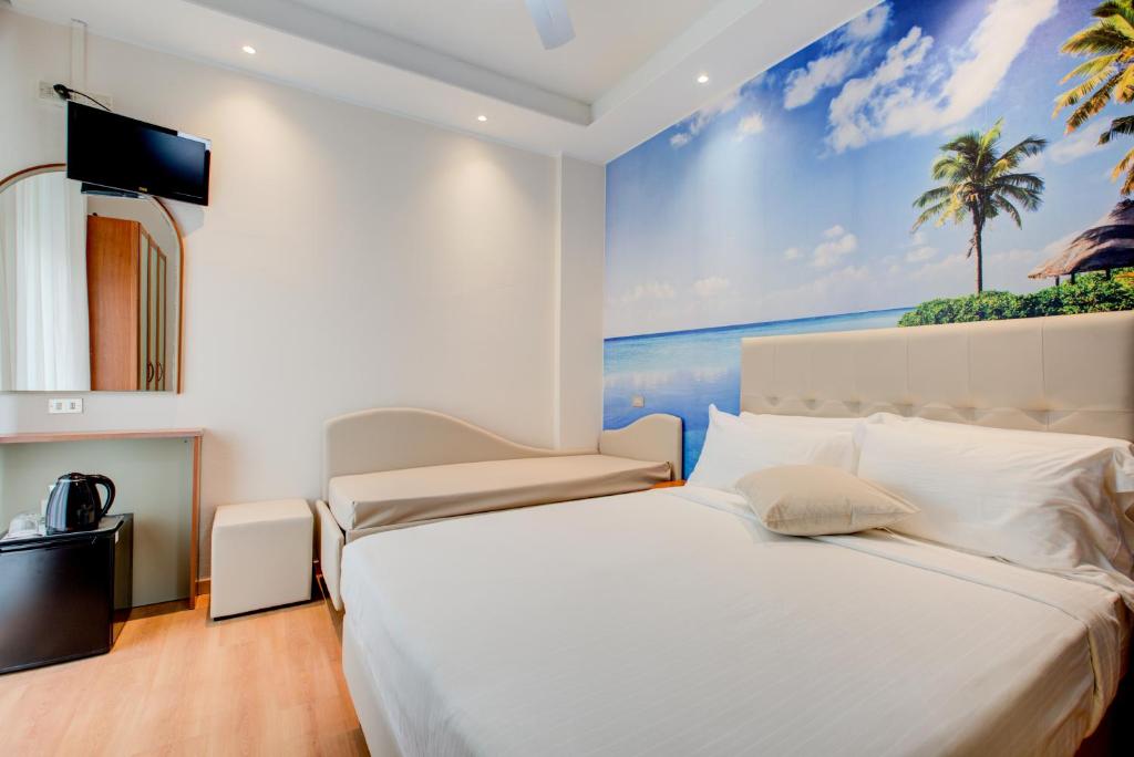 Postel nebo postele na pokoji v ubytování Hotel Sympathy
