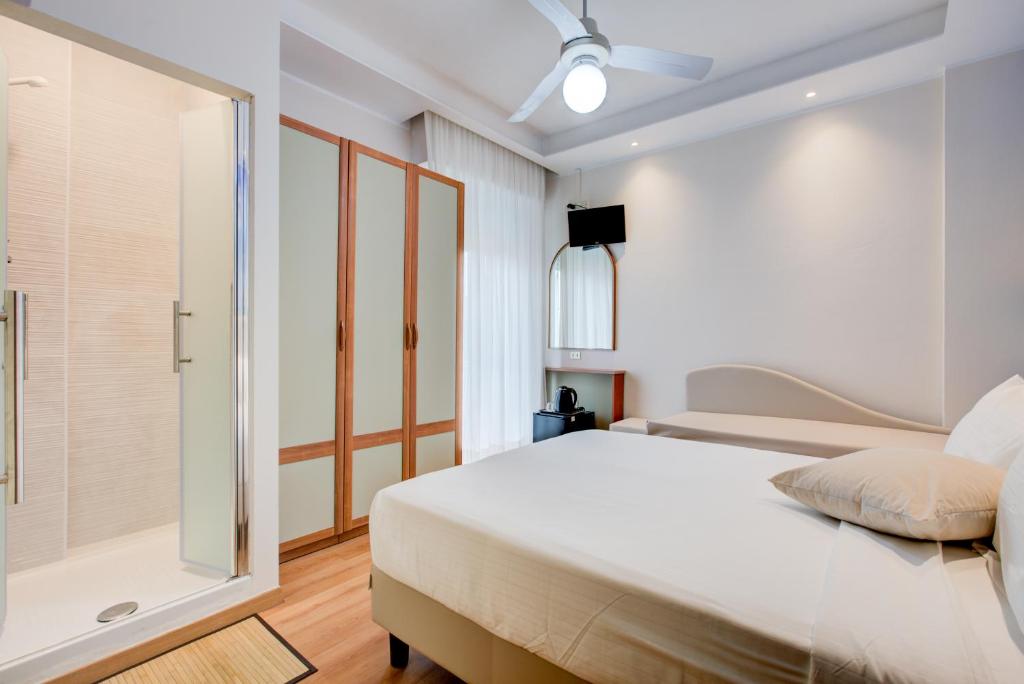 Postel nebo postele na pokoji v ubytování Hotel Sympathy