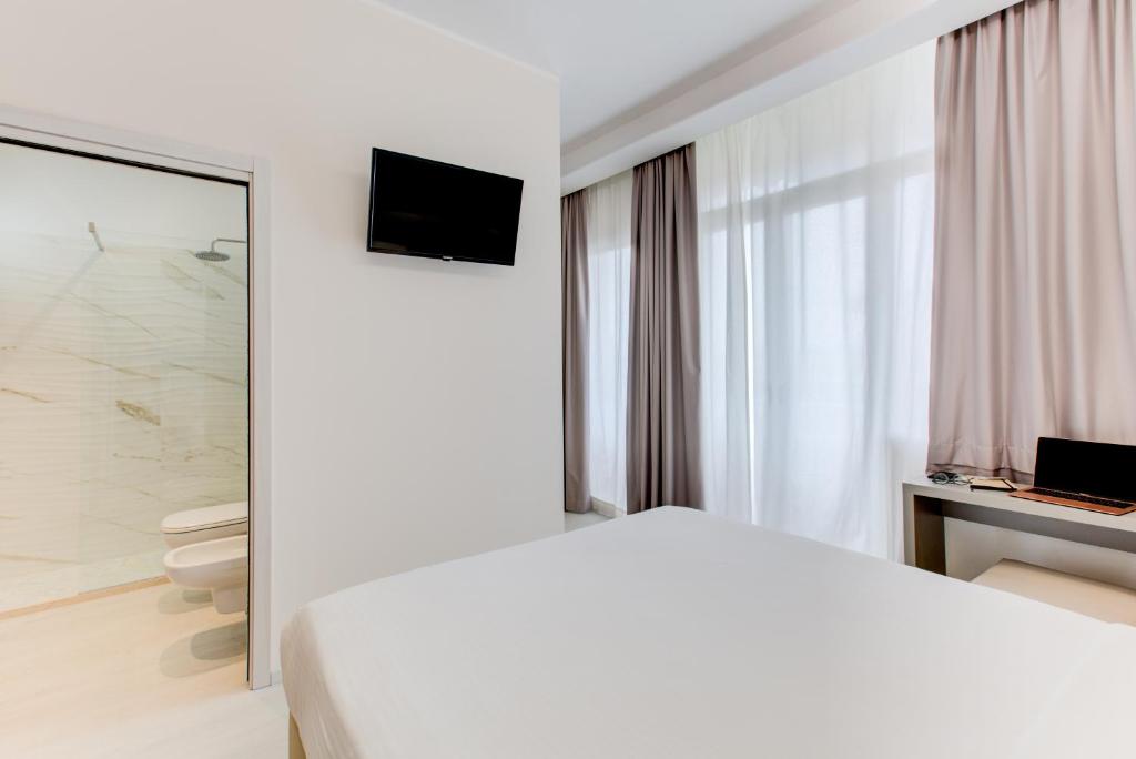 TV a/nebo společenská místnost v ubytování Hotel Sympathy