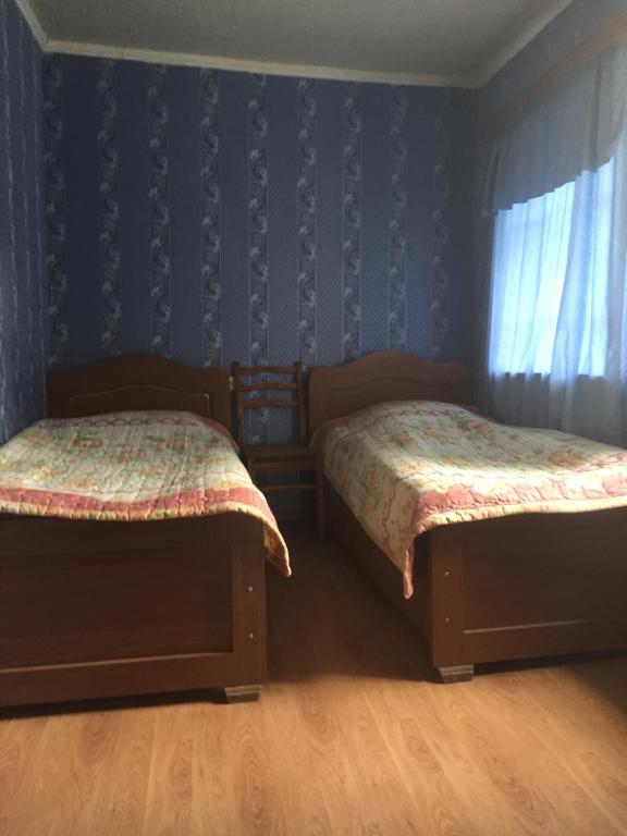 Postel nebo postele na pokoji v ubytování Guesthouse LALI GULEDANI