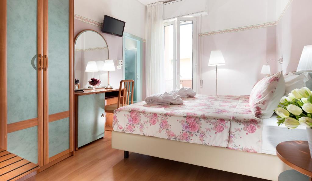 Postel nebo postele na pokoji v ubytování Hotel Sympathy