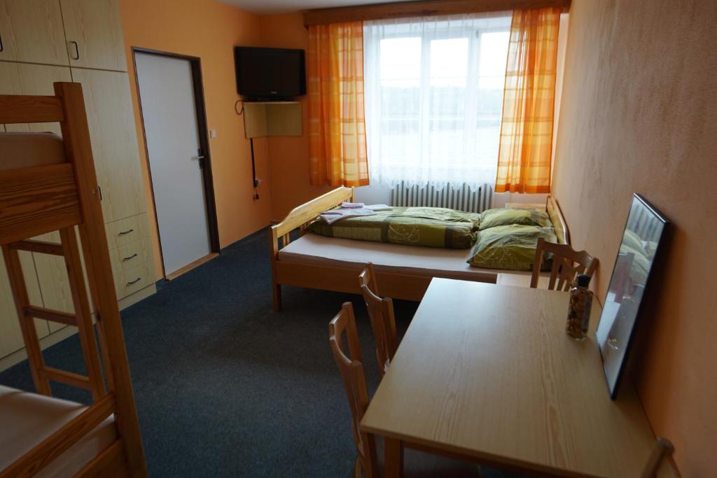 Postel nebo postele na pokoji v ubytování Penzion Hamr