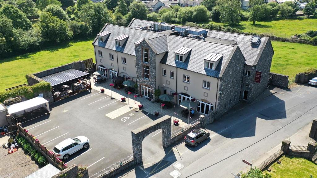 an aerial view of a large building with a parking lot at Deebert House Hotel in Kilmallock