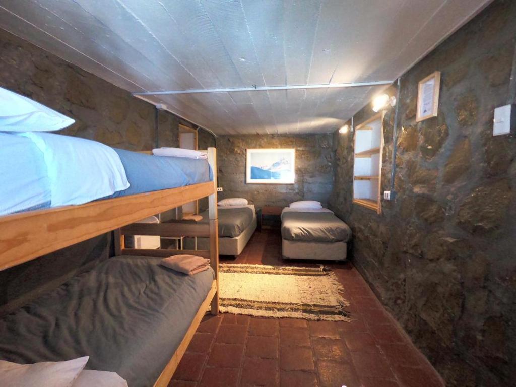 Postel nebo postele na pokoji v ubytování Cordillera Hostel