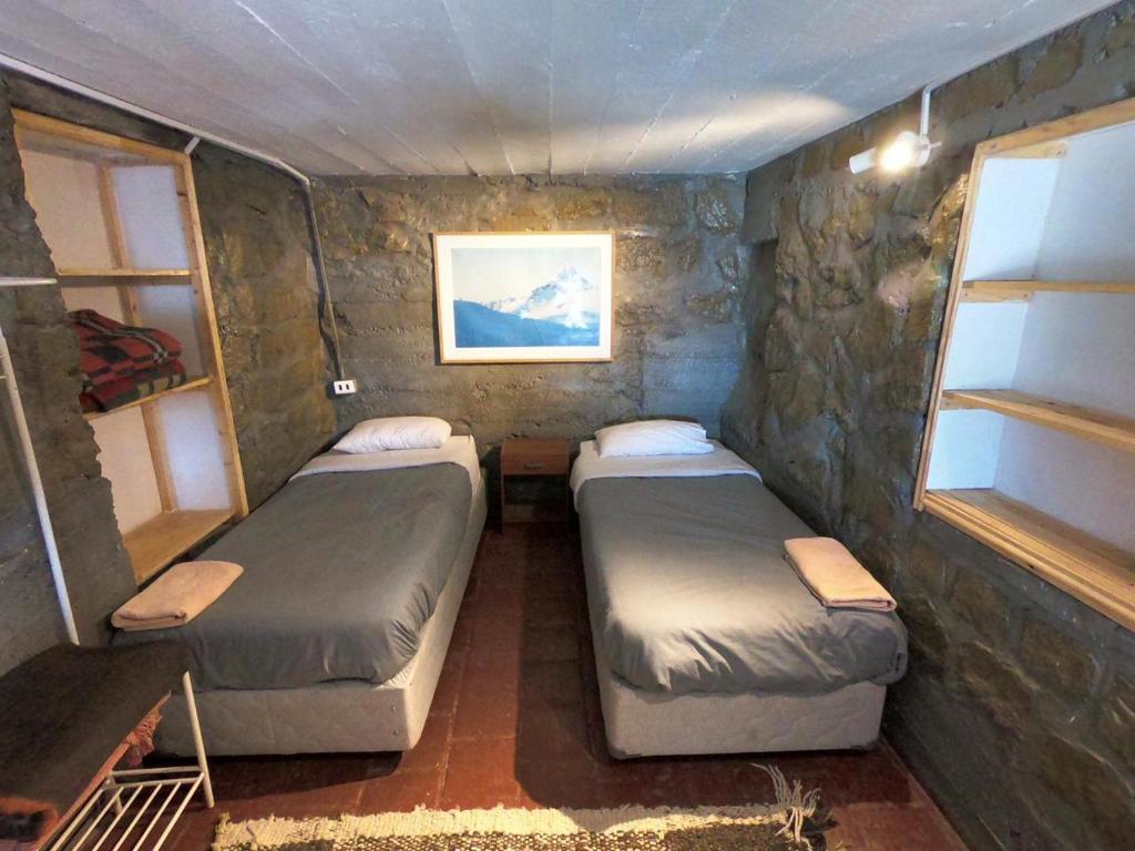 Postel nebo postele na pokoji v ubytování Cordillera Hostel