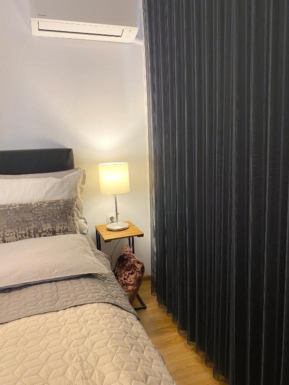 A bed or beds in a room at Snow Sheep apART - апартамент с две спални