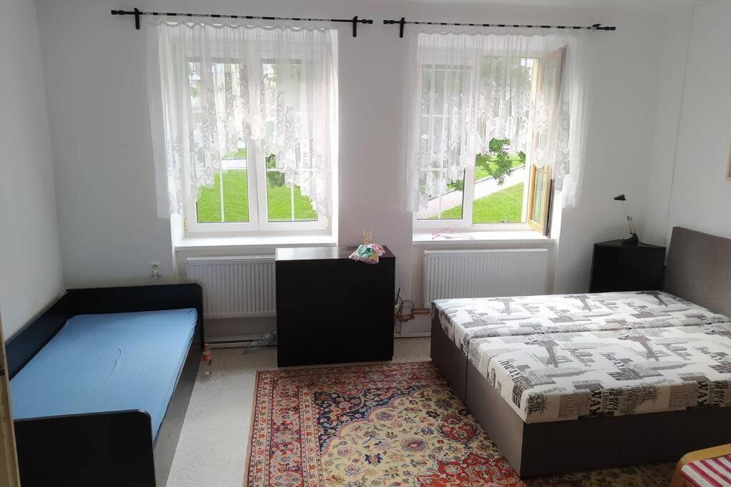 Postel nebo postele na pokoji v ubytování Apartmán na Náměstí ve Štramberku