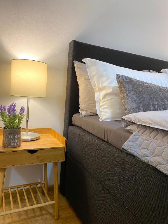 A bed or beds in a room at Snow Sheep apART - апартамент с две спални