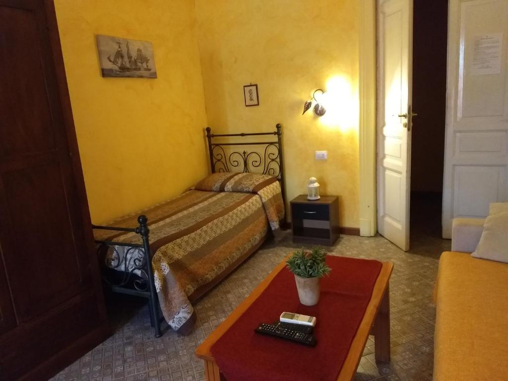 Postel nebo postele na pokoji v ubytování Palazzo Aprile