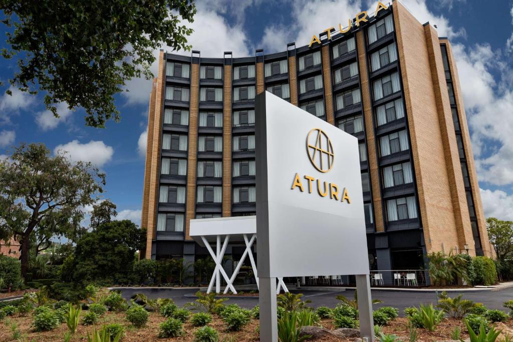 a sign in front of a atrium hotel at Atura Albury in Albury