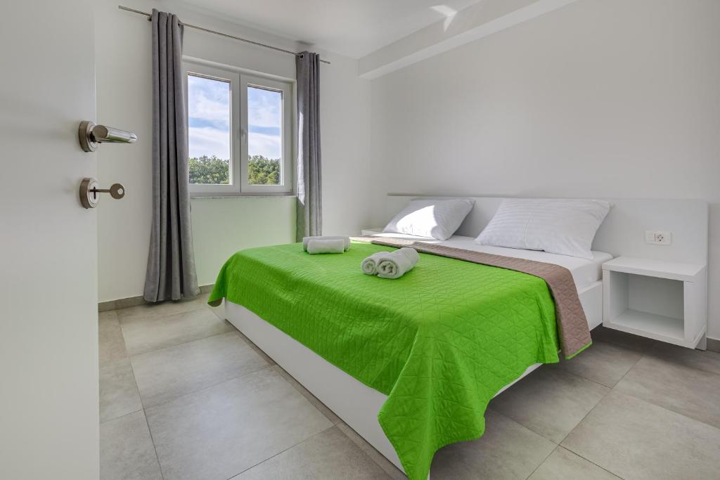 Ein Bett oder Betten in einem Zimmer der Unterkunft Green Point Paklenica