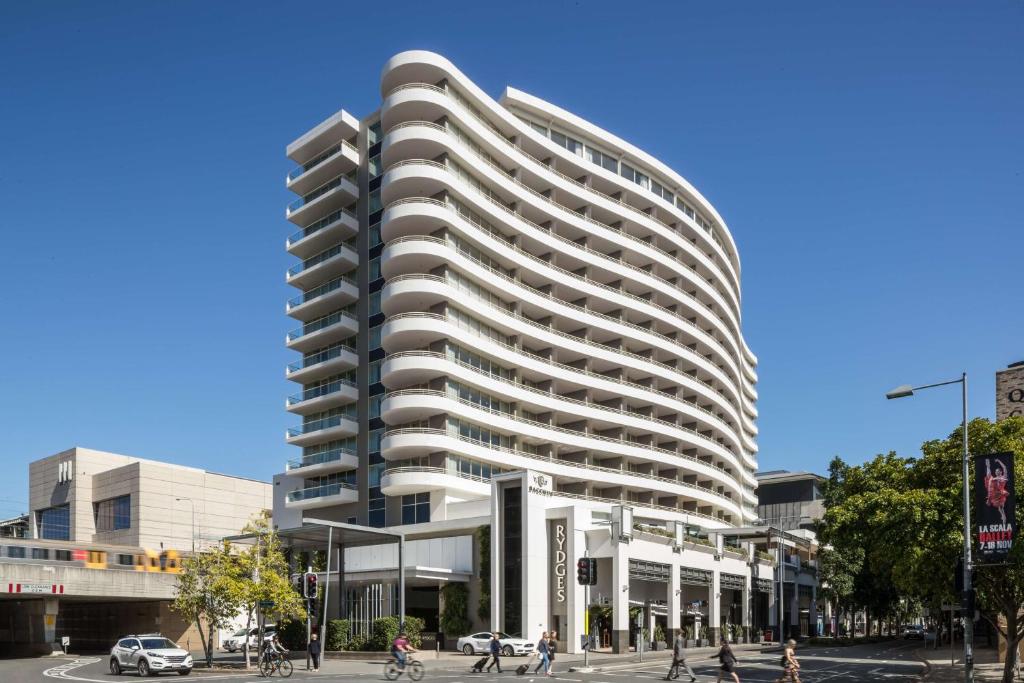 a large building with a large window on top at Rydges South Bank Brisbane in Brisbane