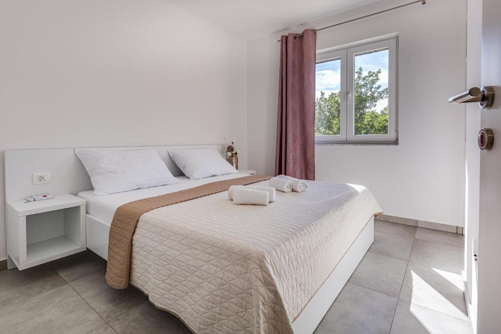 Ein Bett oder Betten in einem Zimmer der Unterkunft Green Point Paklenica