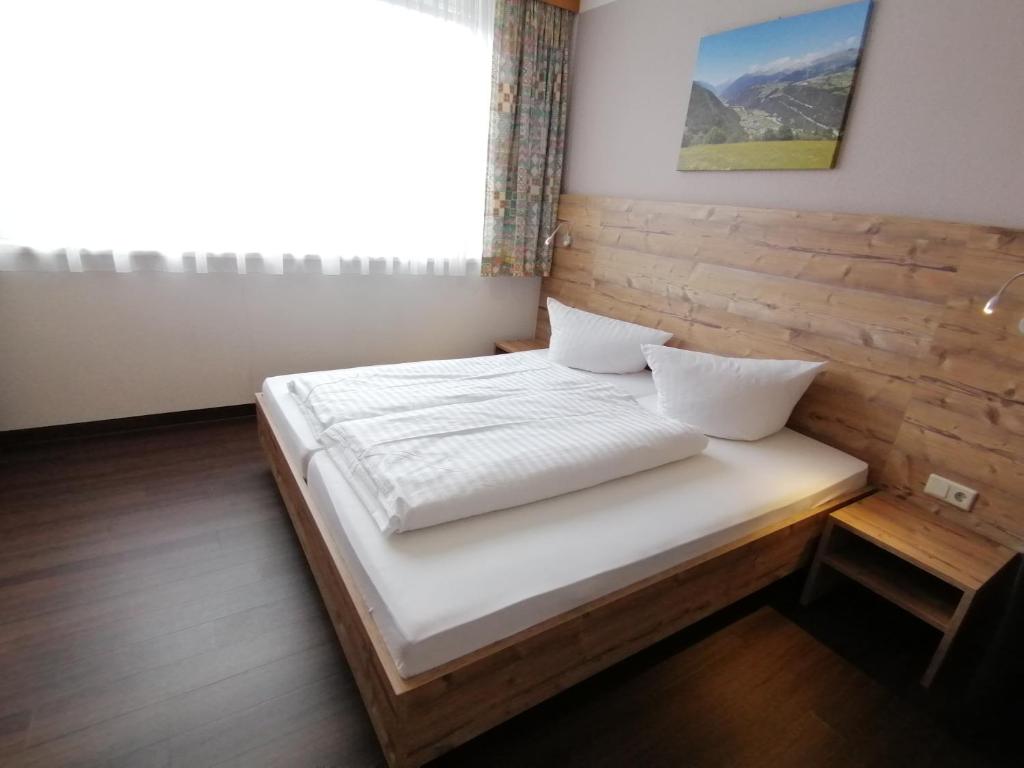 Postel nebo postele na pokoji v ubytování Appartements Rosmarie