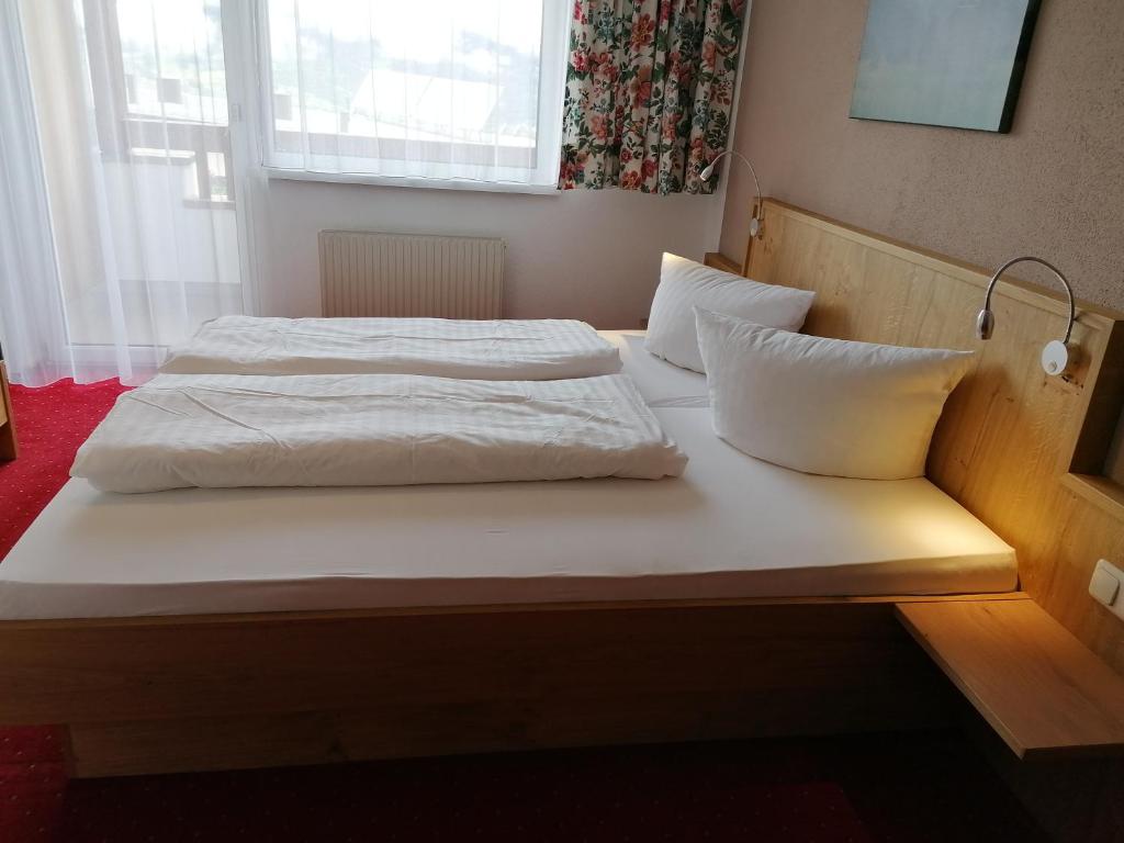 Postel nebo postele na pokoji v ubytování Appartements Rosmarie