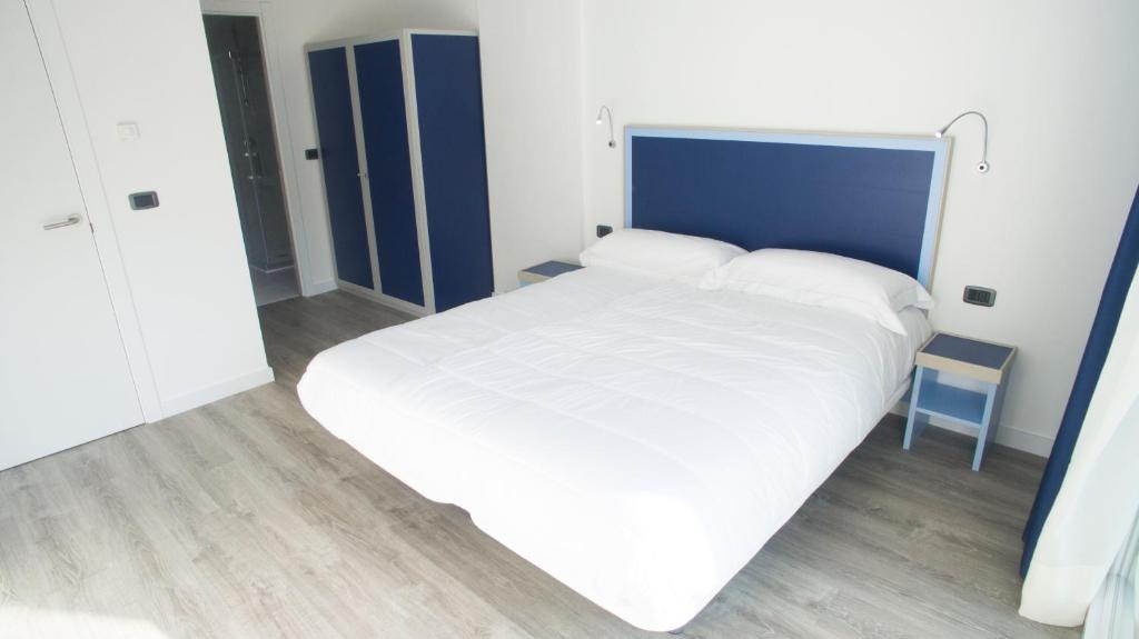 Posteľ alebo postele v izbe v ubytovaní Piamarta Apartments