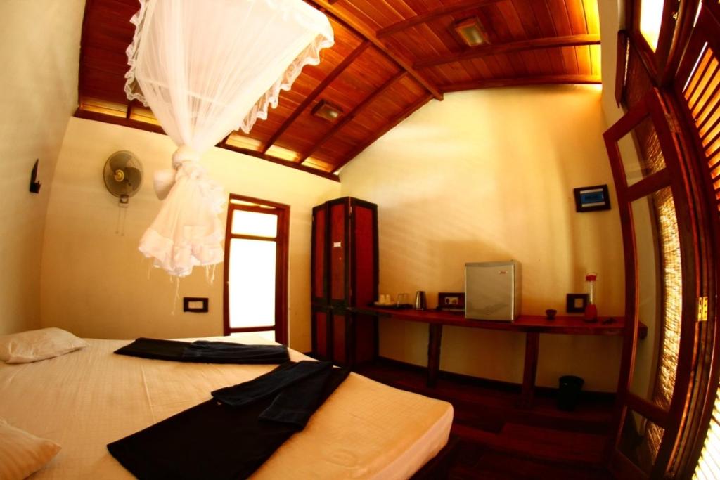 Postel nebo postele na pokoji v ubytování Ella Okreech Cottages