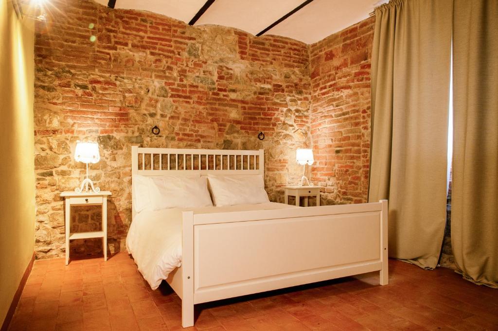 Postel nebo postele na pokoji v ubytování Morami Wine Agriturismo