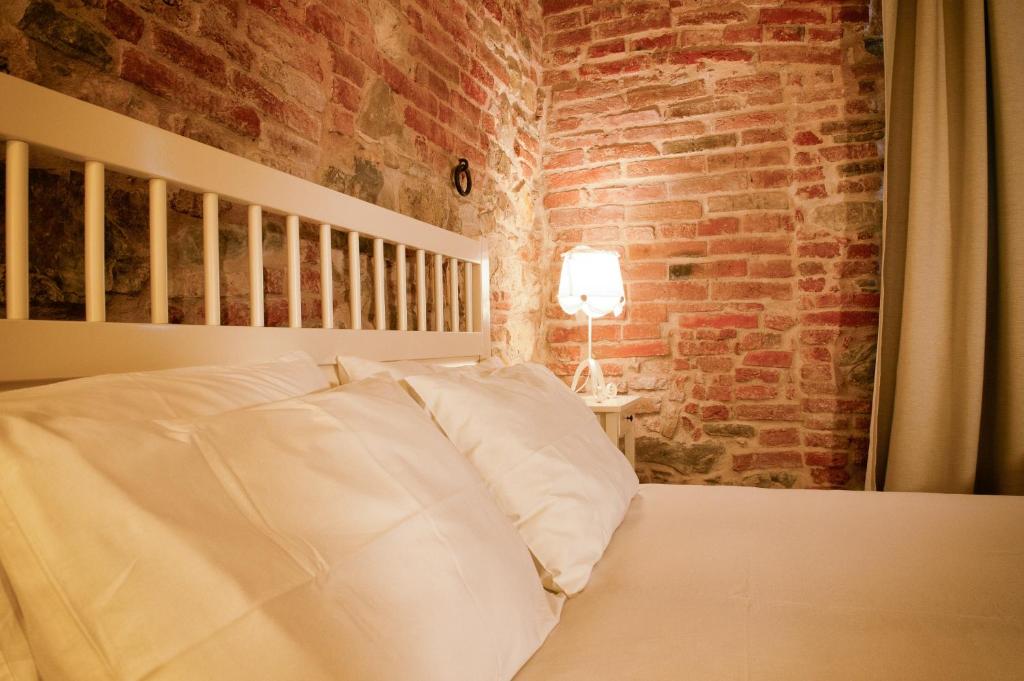 Postel nebo postele na pokoji v ubytování Morami Wine Agriturismo