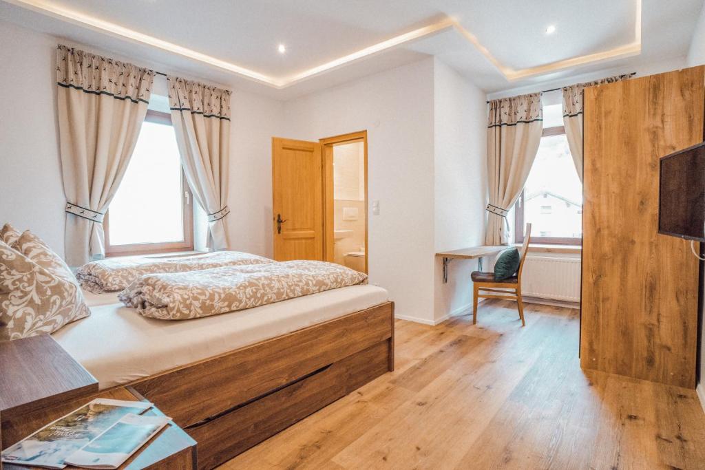 Postel nebo postele na pokoji v ubytování Gasthof Geraerhof
