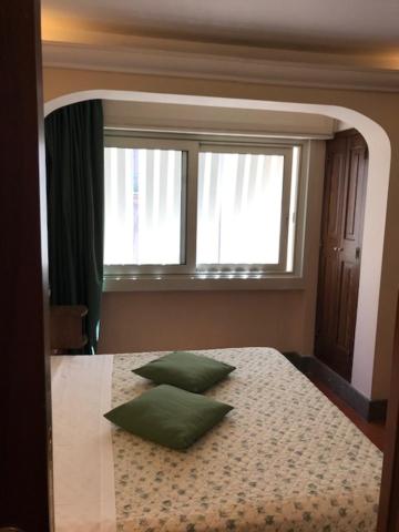 Postel nebo postele na pokoji v ubytování Hotel OKAPI