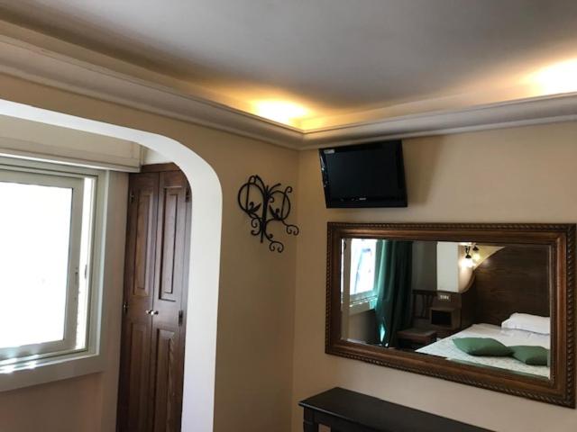 Postel nebo postele na pokoji v ubytování Hotel OKAPI