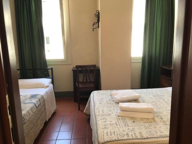 Postel nebo postele na pokoji v ubytování Hotel OKAPI