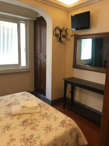 Postel nebo postele na pokoji v ubytování Hotel OKAPI