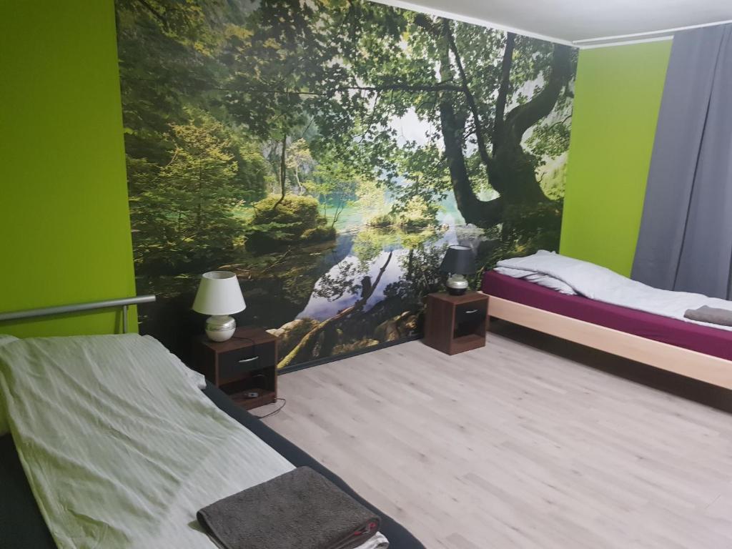 a bedroom with a large painting on the wall at Marktplatz Duisburg in Duisburg