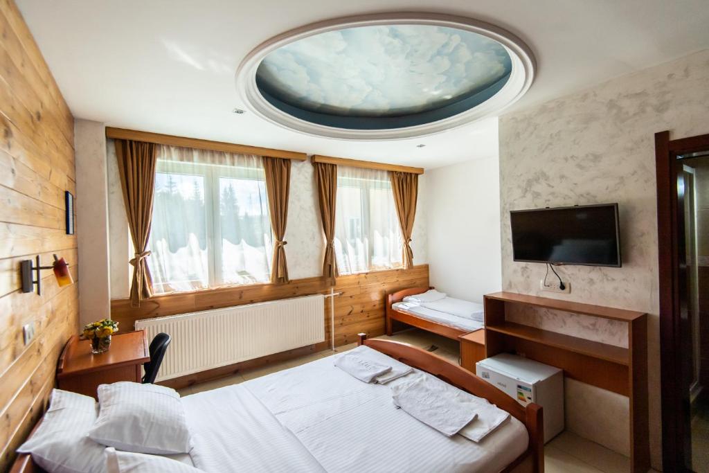 Postel nebo postele na pokoji v ubytování Hotel Enigma