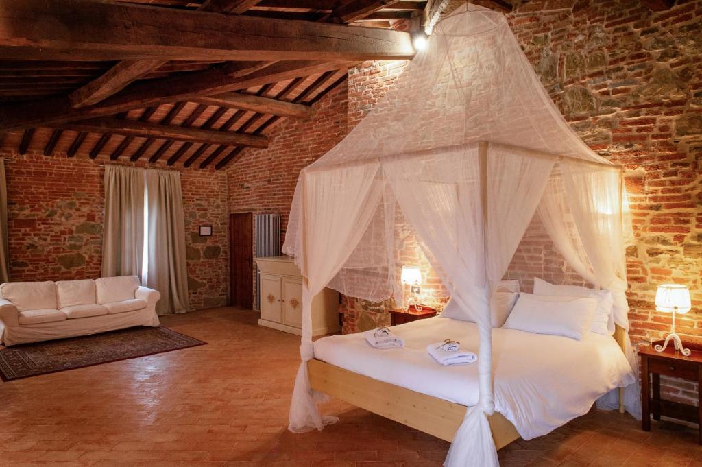 Postel nebo postele na pokoji v ubytování Morami Wine Agriturismo